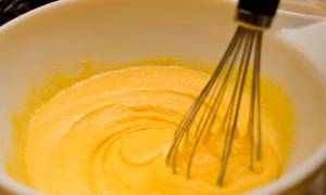 Mix yolks and sugar until pale yellow.