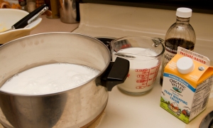 Add milk, cream, vanilla to pot.